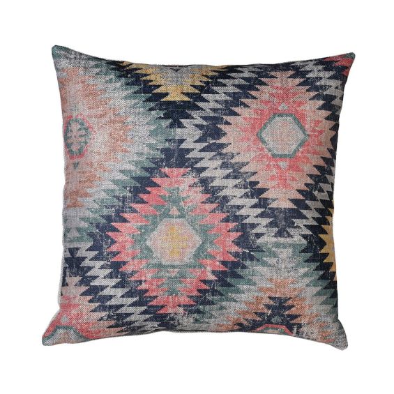 a colourful Aztec zig-zag patterned cushion with a distressed look