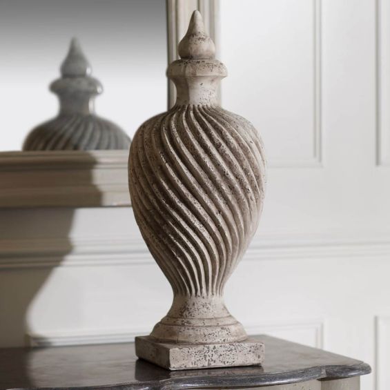 Elegant, distressed finial sculpture with elegant wave pattern 