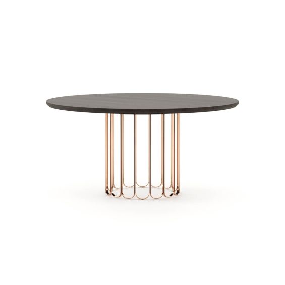 A luxurious oak table with an art deco-inspired copper base 