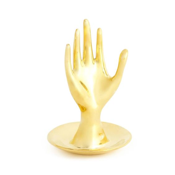 A solid brass hand-shaped ring holder