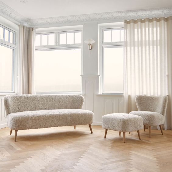 Irresistibly cosy, sheepskin upholstered  two-seater sofa