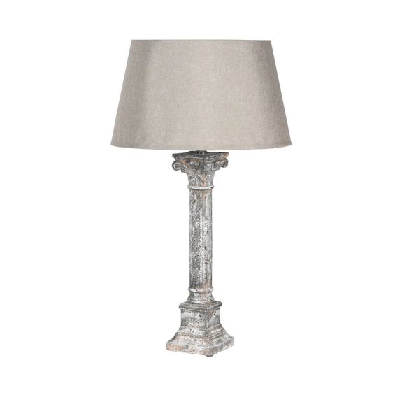 A luxurious antique aged stone pillar table lamp with a matching lampshade