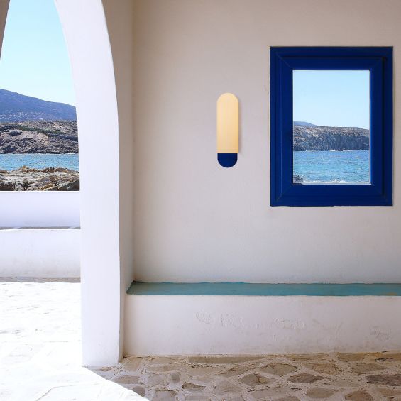 A luxury, large wall light by Schwung with a Santorini Blue finish and glass opal shade