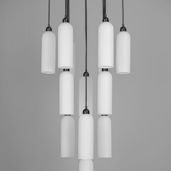 A luxurious chandelier by Schwung with 13 translucent opal glass lampshades and a black gunmetal finish 