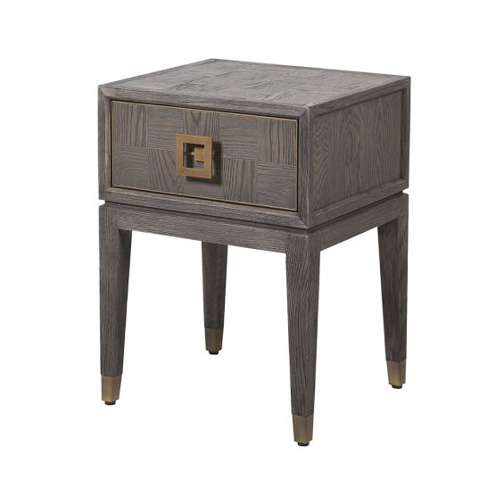 A luxury bedside table with a brown, checkerboard parquetry wood finish and brass details 