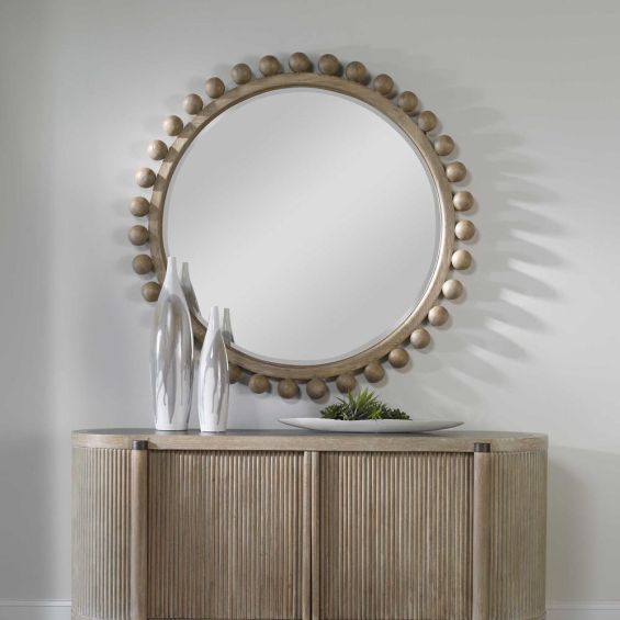 Natural finished round mirror with wooden spheres surrounding the border