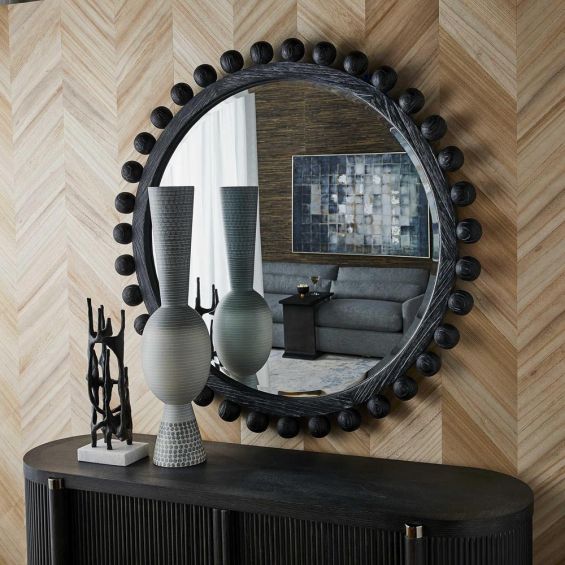 Sculptured ebony wooden framed mirror with surrounding spheres
