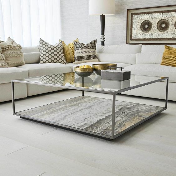 Sleek coffee table with eye-catching marble base and grey minimal frame with glass top