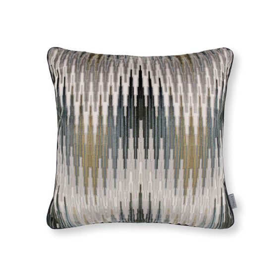 A multi coloured cushion with a velvet chevron design