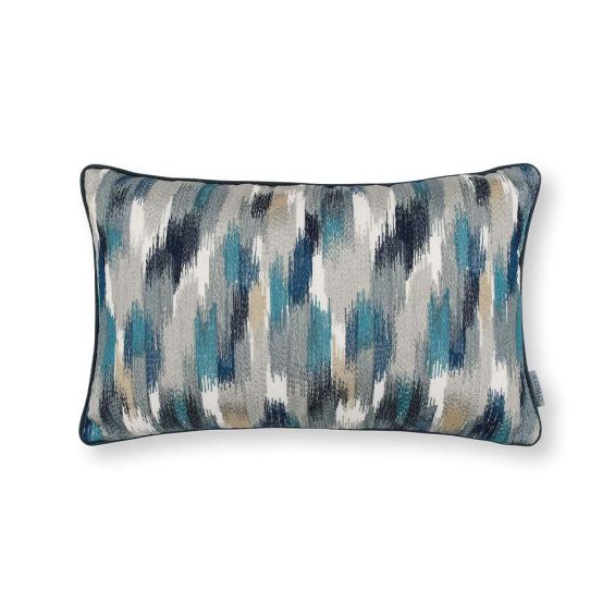 An embroidered linen cushion in cool blue tones