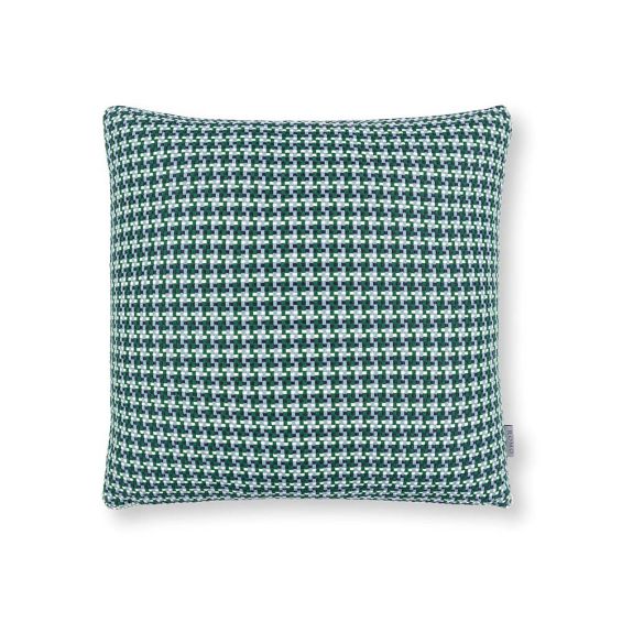A teal houndstooth inspired outdoor cushion