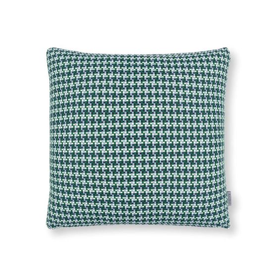 A teal houndstooth inspired outdoor cushion