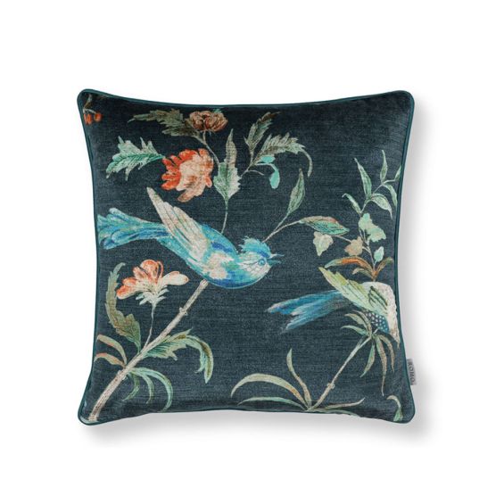 A nature-inspired cushion with a bird design and deep navy tones