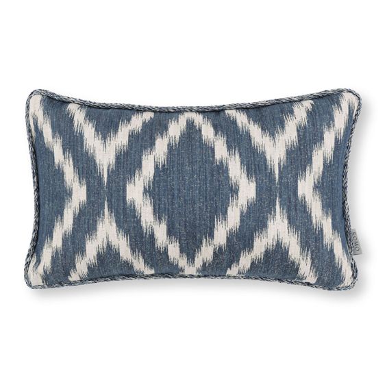 A stylish cushion by Romo with a geometric pattern and a beautiful blue finish