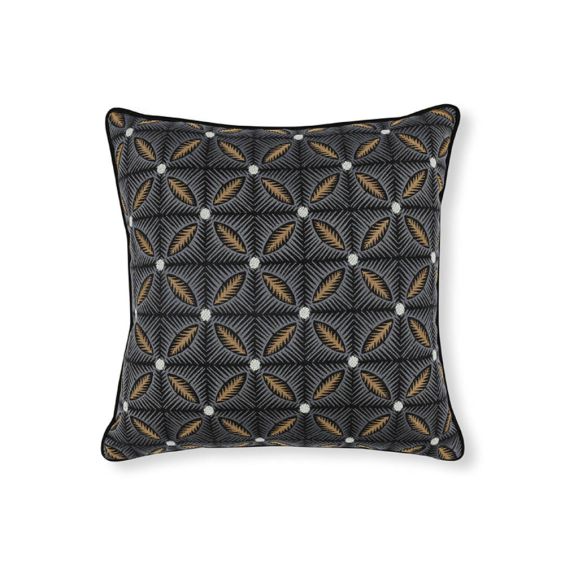Black cushion with geometric design and mustard reverse