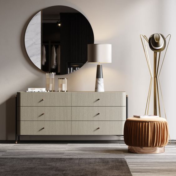 A luxurious matte grey chest of drawers with an iron frame and copper accents