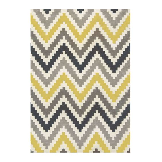 Hand-tufted wool rug with chevron pattern in yellow