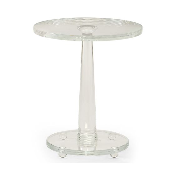 An elegant side table by Caracole with a contemporary clear glass design