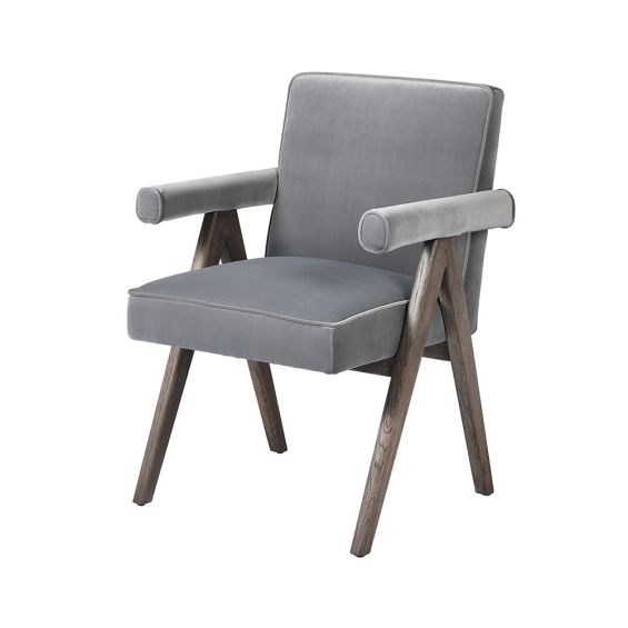 A stylish armchair with a luxury grey upholstery and v-shaped oak legs