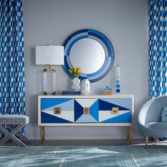 A glamorous contemporary sideboard with painted glass and brass accents