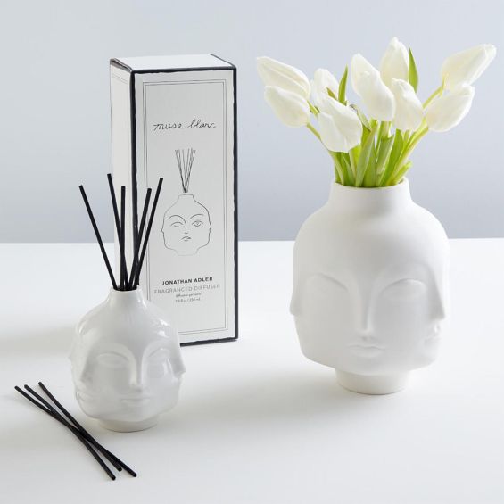 A contemporary glossy white fragranced room diffuser by Jonathan Adler