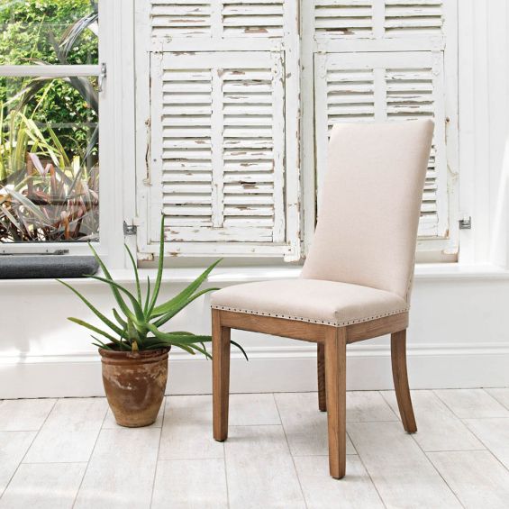 upholstered dining chair in beige with studding