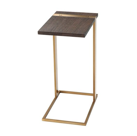 A luxury end table with a brushed brass base and walnut coloured table top