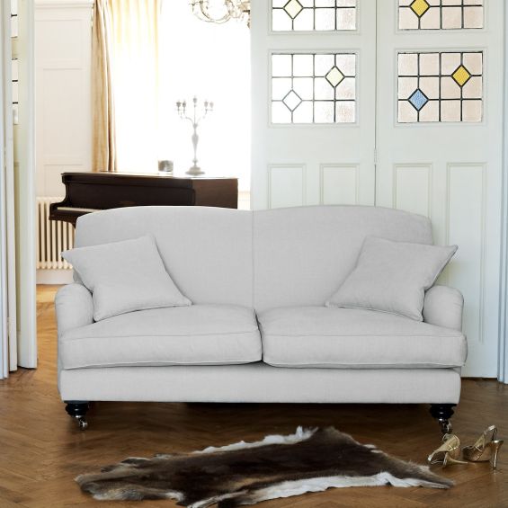 Elegant, British style sofa with firm back and cushioned seating