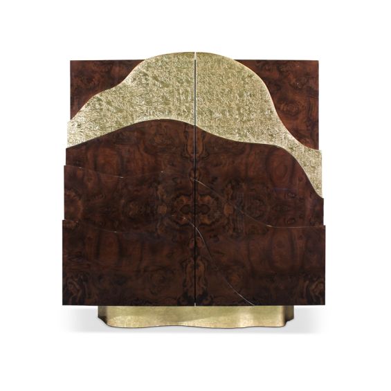 A luxurious cabinet with layers of natural wood and a glamorous gold leaf finish with a high gloss varnish