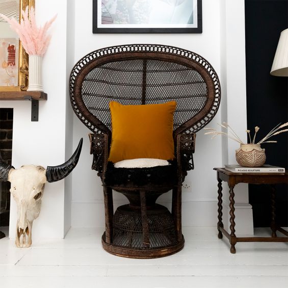 A stylish velvet cushion with a mustard colour and square shape