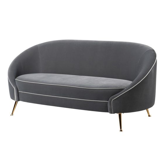 Luxurious modern grey velvet curved sofa with golden tapered legs and contrast piping