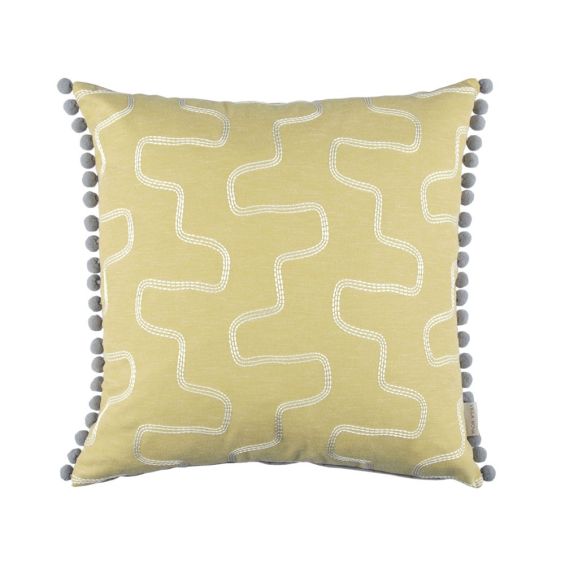 Abstract silver embroidered design on yellow cushion