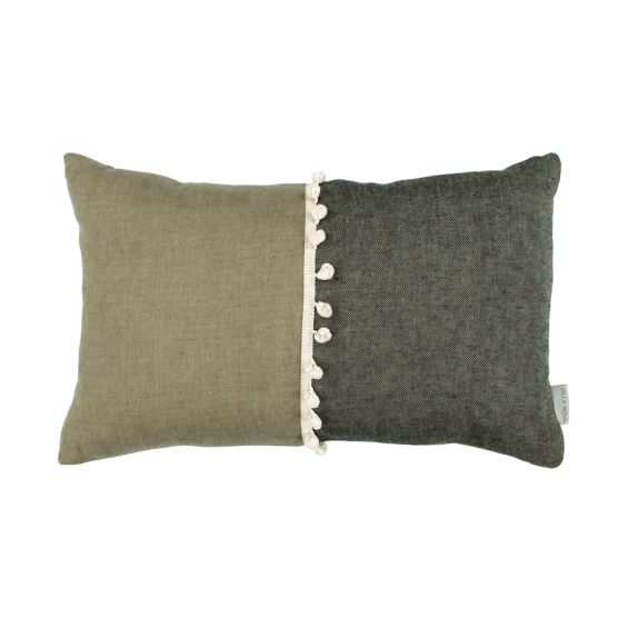 A luxurious two-toned linen cushion with bobble details