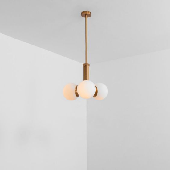 A chic, early century inspired LED pendant with translucent opal globes