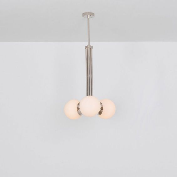 A glamorous polished nickel ceiling pendant inspired by early century and industrial style 