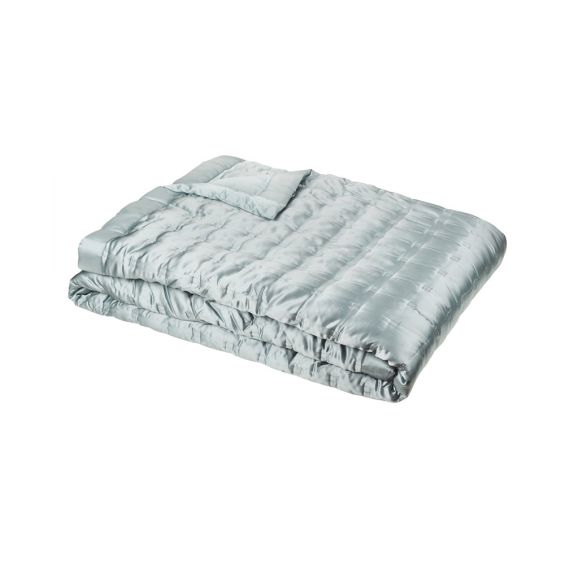 A luxurious teal-toned luxury silk bedspread