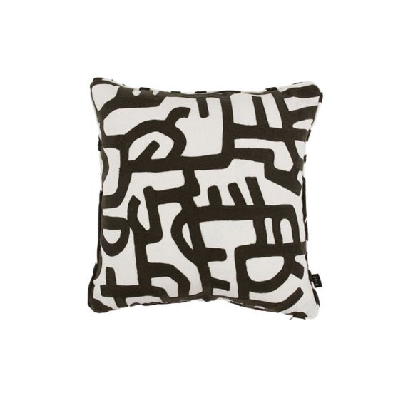 A monochrome white linen cushion with an abstract doodled design 