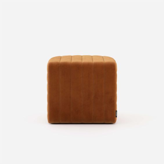 Luxury velvet pouffe with padded, ribbed design