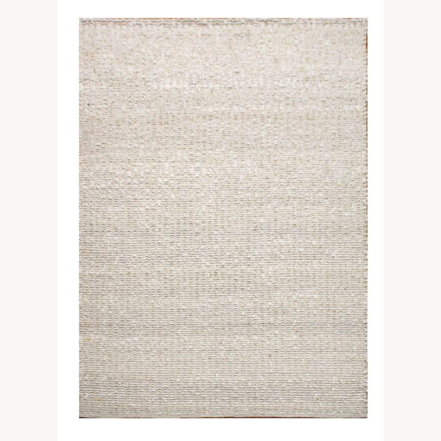 Soft and textured wool rug in light brown