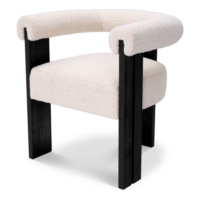 Sleek boucle dining chair with round back and black wooden legs