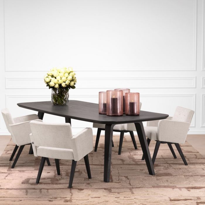 Padded cream dining chair with boxy silhouette and armrests, Complete with four black wooden legs