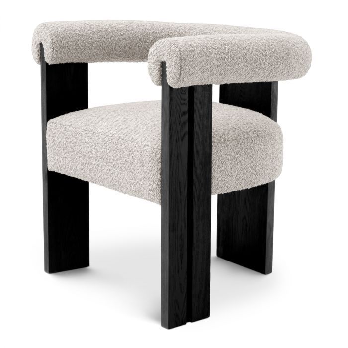Sleek boucle dining chair with round back and black wooden legs
