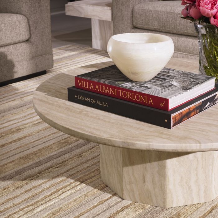 Classy coffee table with circular top and hexagonal base, made from travertine