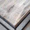 Rectangular coffee table with black metal legs and brown wooden tabletop