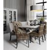 Large, grey rectangular dining table with crossed legs at either end