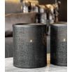 Understated black metal candle holders with small hole details