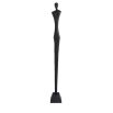 Sleek metal sculpture of a human-like silhouette, in black finish. Floor standing size