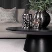 Low round black coffee table with cylindrical base