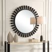 Elevate your decor with the Aziel Round Mirror—a stunning fusion of sleek satin black and modern sphere accents for a bold statement.