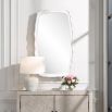 Rounded rectangular mirror with white waved edges
